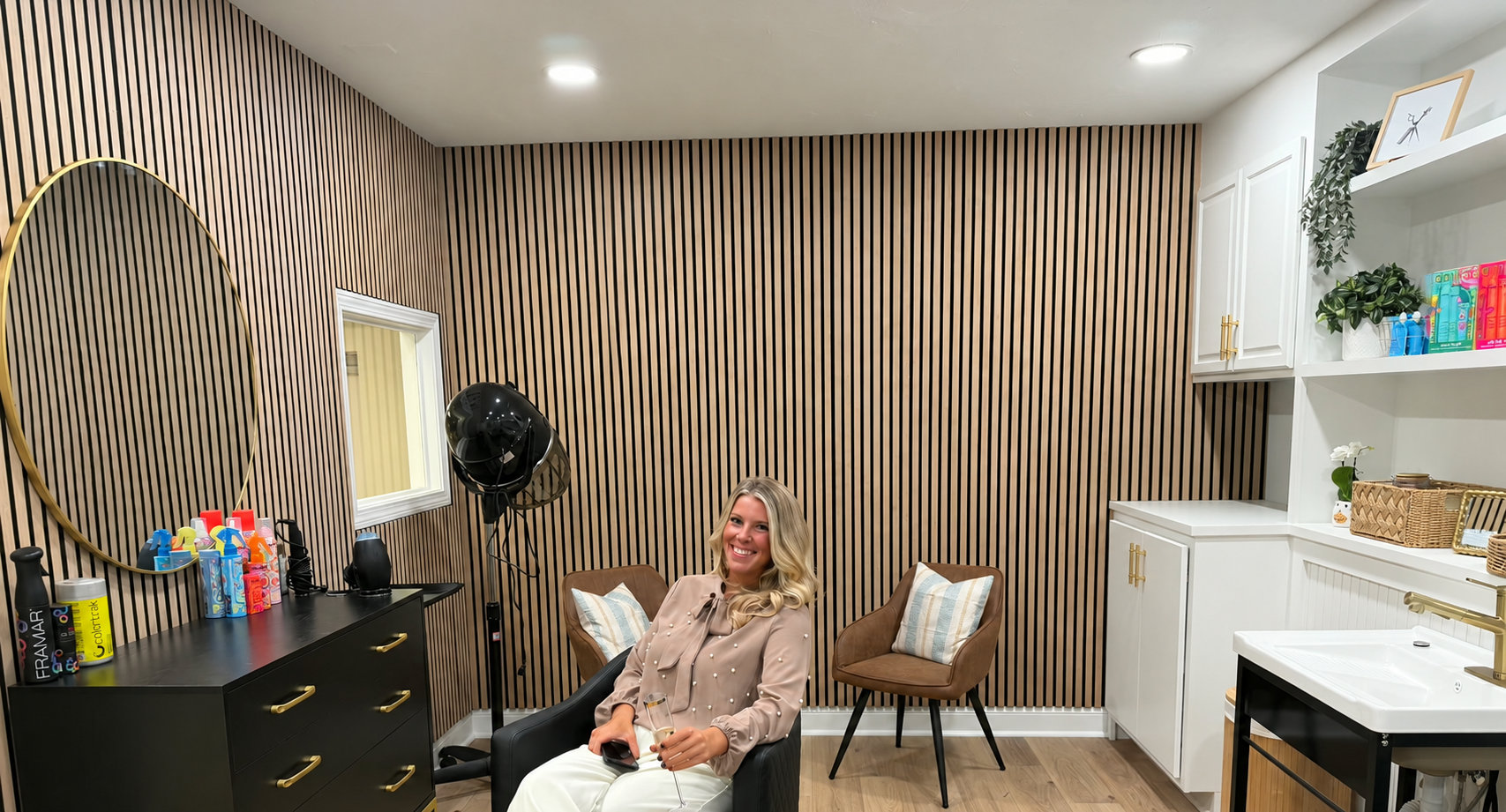 Heather, owner of The Mane Loft hair salon, seated inside her Nashua, NH salon